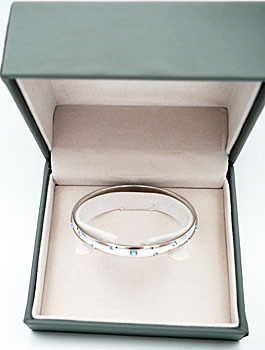 Yves Saint Laurent YSL zilveren bangle armband  extra small met 20 lichtblauwe crystallen.