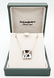 Yves Saint Laurent zilveren hanger met YSL logo in crystallen